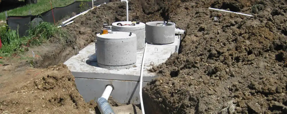 Septic system repair and installation site with tank access ports in Greensboro, NC